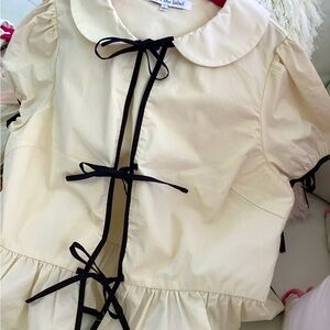 Sophie the label peplum cream top with black trim L